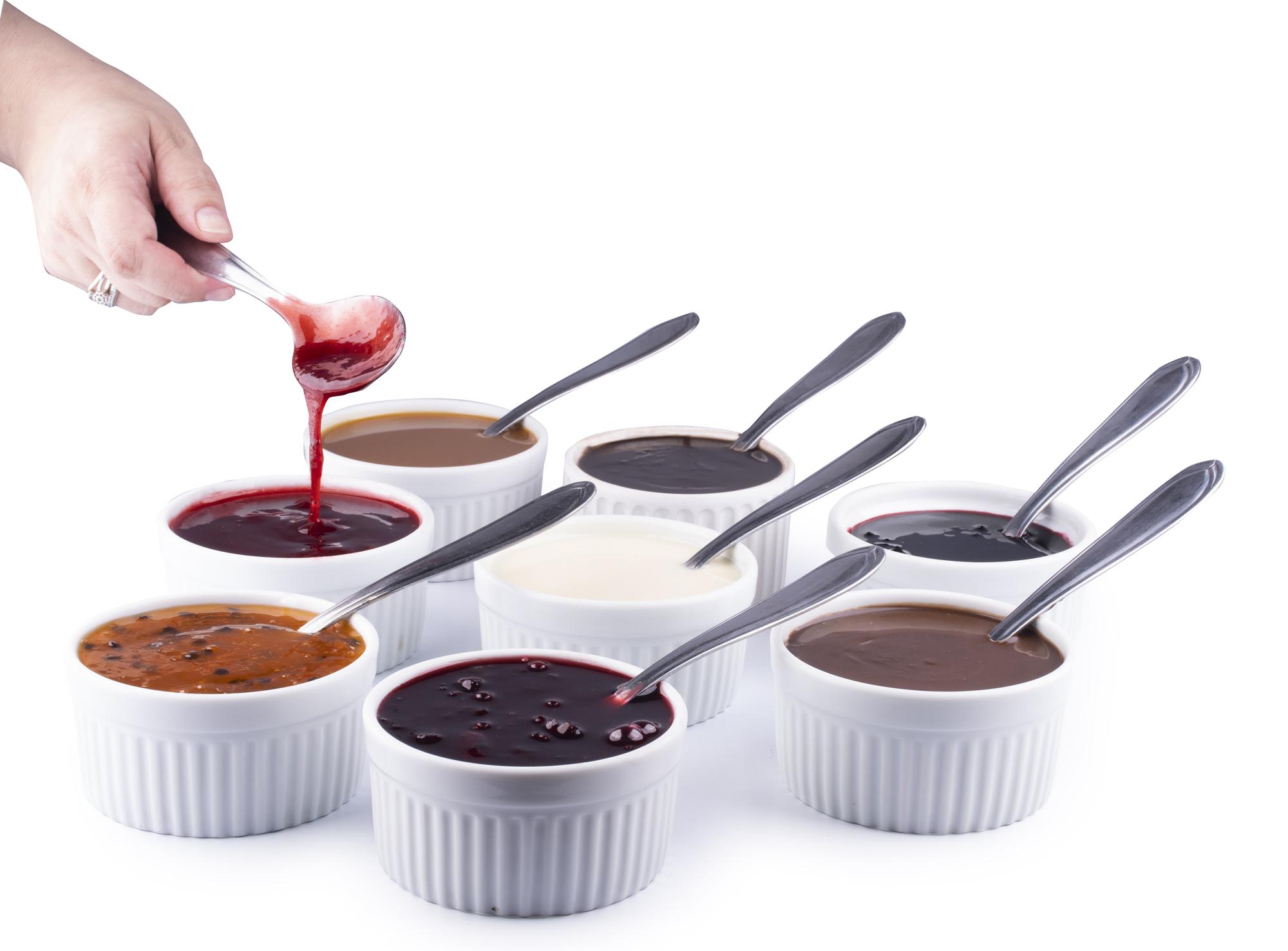 Students tasting a sauce during class